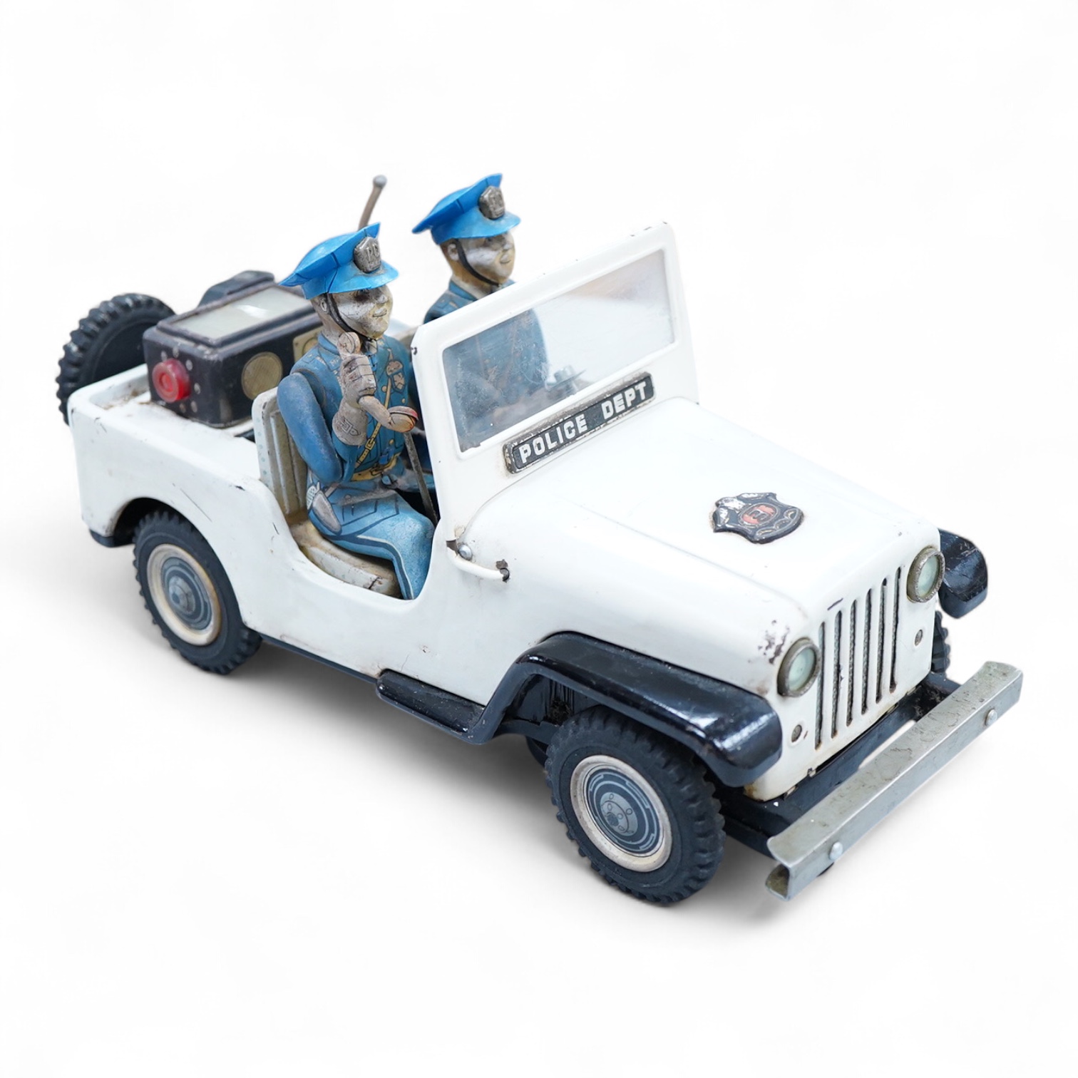 A 1960s Japanese T.N. Nomura battery powered tinplate and plastic Police Department Jeep, impressed manufacturer’s logo and ‘Made in Japan’ to the base